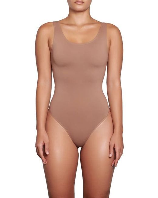 https://img.stylemi.co/unsafe/fit-in/520x650/filters:fill(fff)/https://img.stylemi.co/unsafe/0x0/products/nordstrom/29224132-skims-soft-smoothing-thong-bodysuit-in.jpg