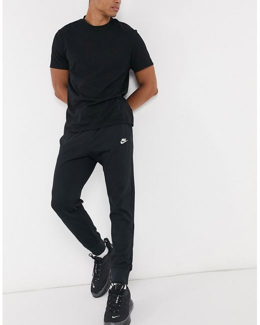 Nike club essentials panelled cuffed joggers in black Clearance