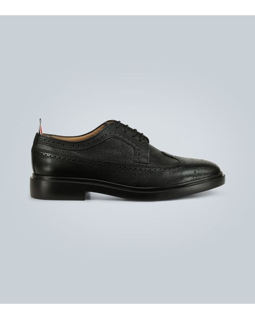 Thom Browne Longwing Brogue Oxfords in Black | Stylemi